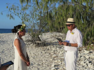 Husband reading vows in ceremony
