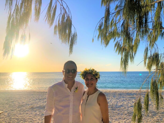 Two people on beach during vow renewal at Wilson Island