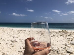 Glass of rose on the beach